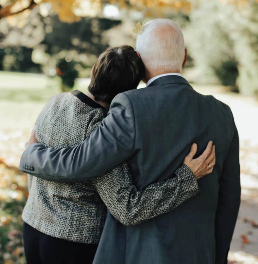 Two people supporting each other